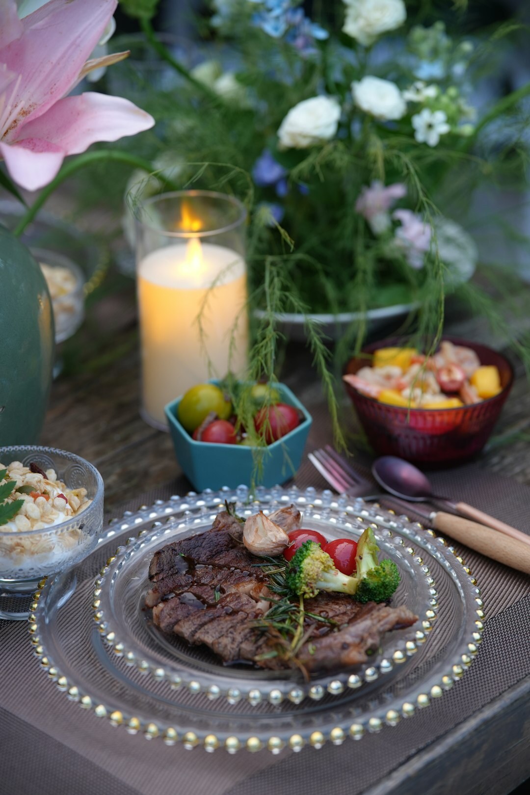 Grilled vegetables and meat on a summer garden table