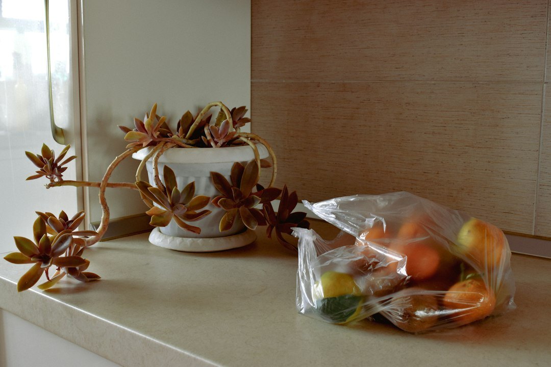 Fresh spring herbs and vegetables on a kitchen table