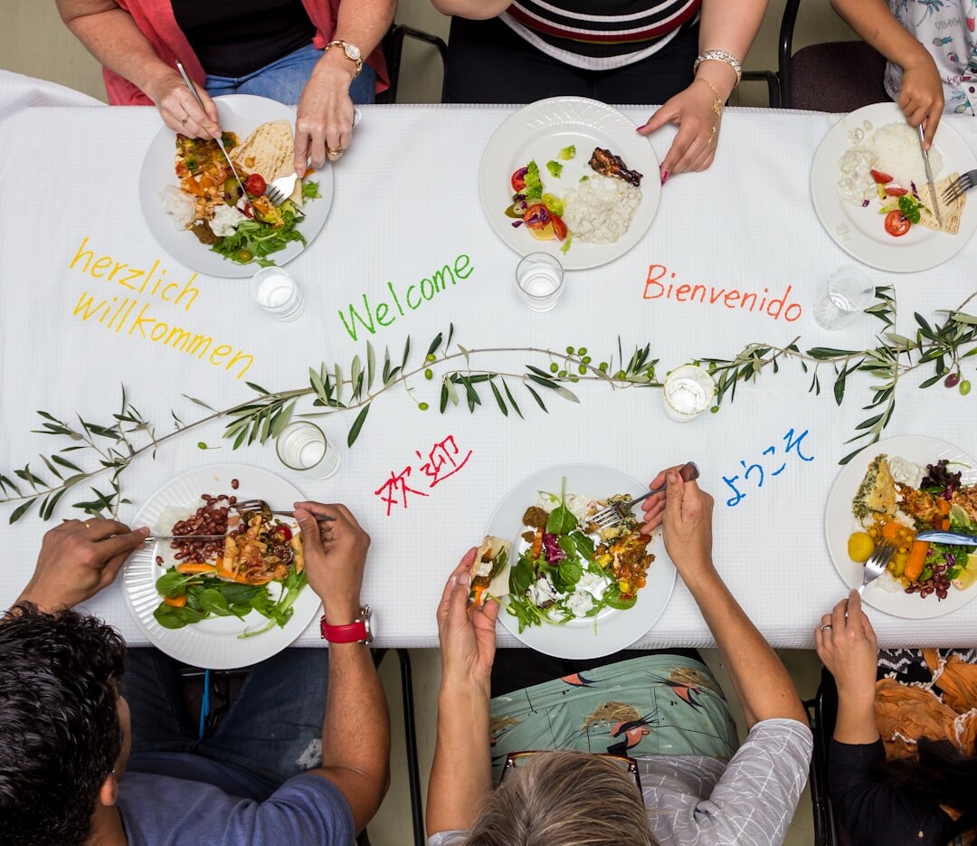 Family gathered around a dinner table sharing a meal