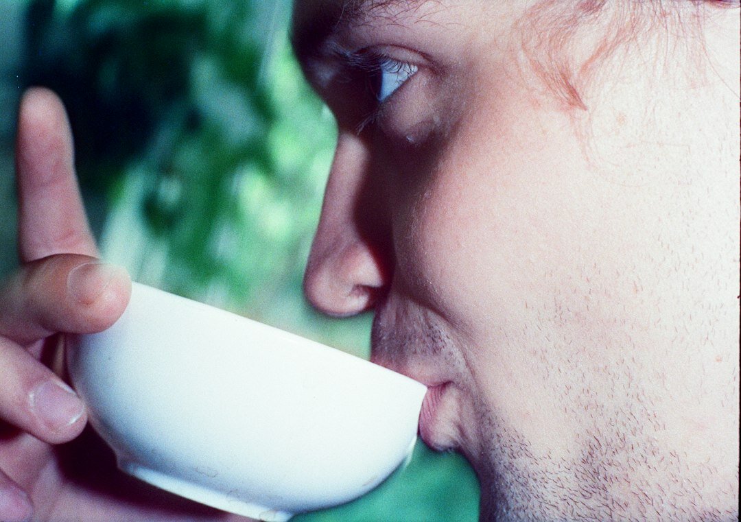Czech man tasting homemade soup in a kitchen