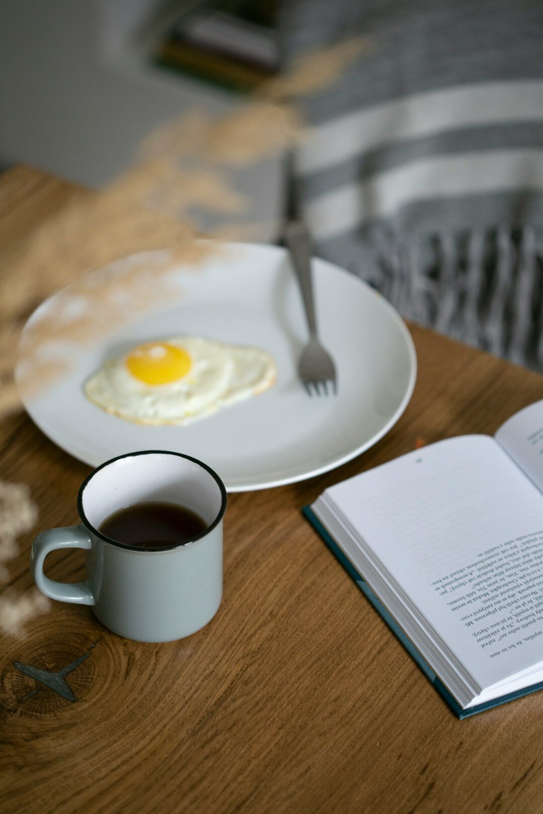 Notebook and cup of tea on a kitchen table for writing recipes